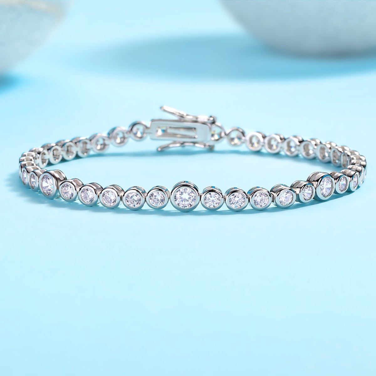 Graduated Moissanite Bezel Tennis Bracelet with Tab - inserted Clasp - La Pretti