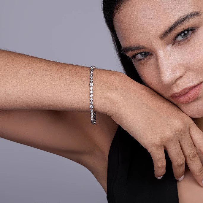 Graduated Moissanite Bezel Tennis Bracelet with Tab - inserted Clasp - La Pretti
