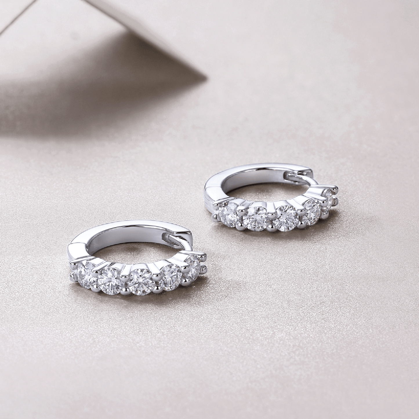 Huggie Moissanite Hoop Earrings with Shared Prongs in 18K White Gold Plated Sterling Silver - La Pretti
