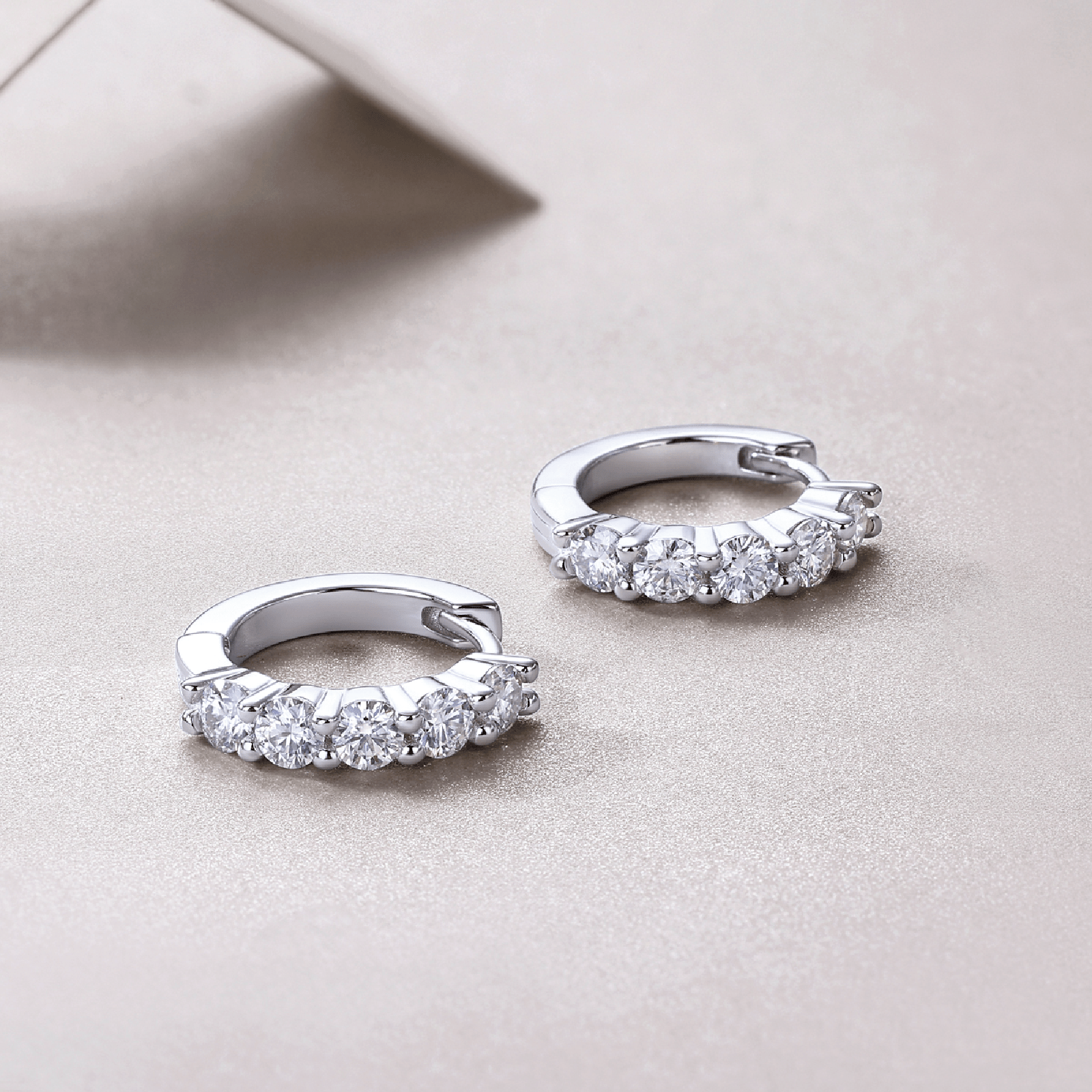 Huggie Moissanite Hoop Earrings with Shared Prongs in 18K White Gold Plated Sterling Silver - La Pretti