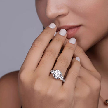 Trilogy Round Moissanite Three Stone Engagement Ring with Hidden Halo in Baskets Pave Setting (5ct. ) - La Pretti